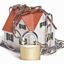Padlock chain around a house showing you are locked out
