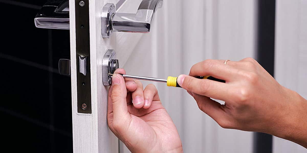 Locksmith installing mortise lock